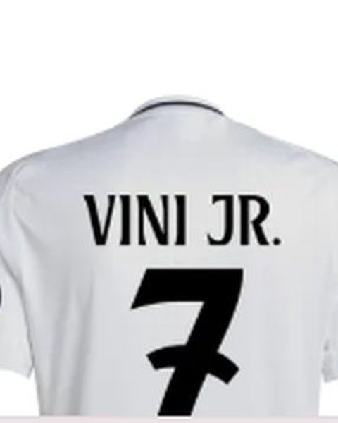 White Real Madrid jersey printed "VINI JR." and number 7, shown from the back.