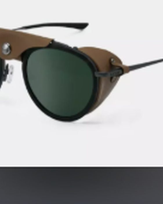Cébé Chill in Glacier sunglasses, black double-bridge frame with camel leather side shields and green lenses