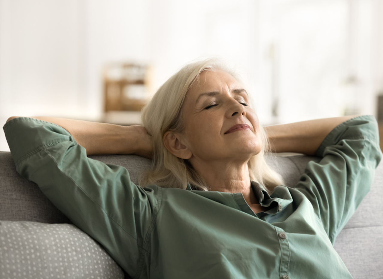 A relaxed participant browsing the raffle page from her sofa.